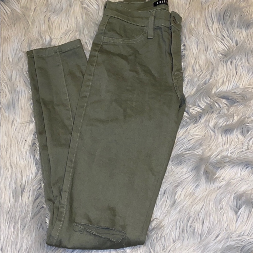 Green fashion nova jeans with slits in both knees